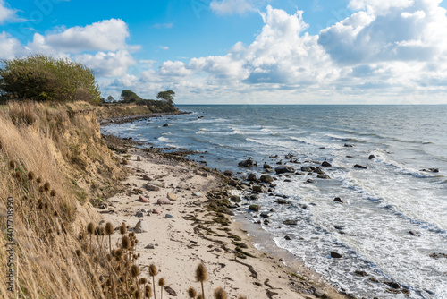 Hiking along the steep coast in the southeast towards the lighthouse on the Baltic Sea island of Fehmarn