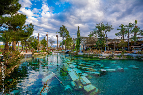 The Antique pool (Cleopatra's Bath) view in Pamukkale. It's a popular touristic destination during a Pamukkale visit photo