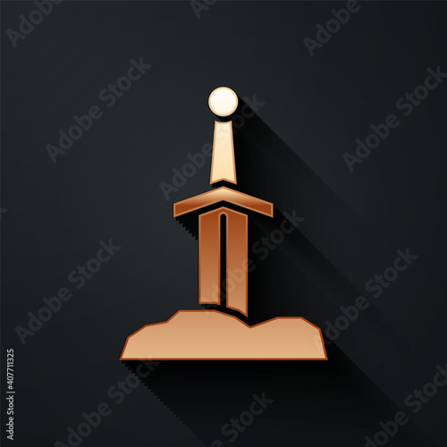 Gold Sword in the stone icon isolated on black background. Excalibur the sword in the stone from the Arthurian legends. Long shadow style. Vector.