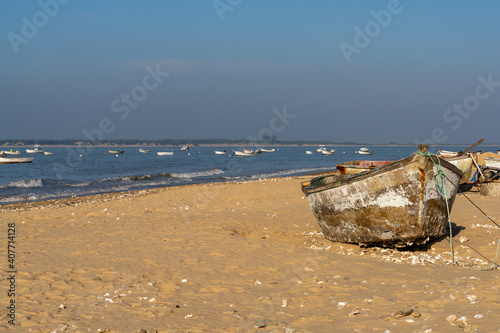 old wooden fishing boats on the beach at Sanlucar de Barrameda