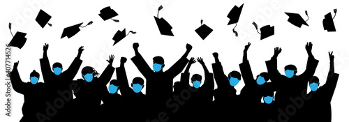 Masked graduates. Graduates throwing cap. Crowd of students. Graduates in an era of pandemic COVID-19