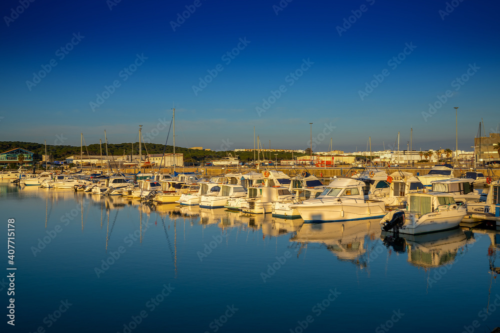 view of the marina and harbor in Barbate at sunset