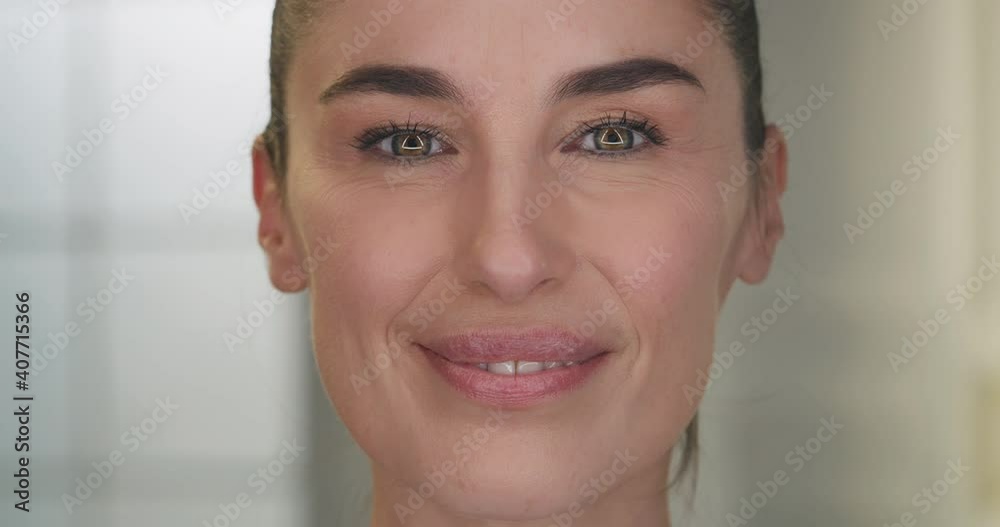 Beauty shot of mature woman face skin with imperfection before and after intensive rejuvenating anti aging treatment smiling in camera isolated on golden fond. Concept: skincare, cosmetics, healthcare Beauty shot of mature woman face skin with imperfection before and after intensive rejuvenating anti aging treatment smiling in camera isolated on golden fond. Concept: skincare, cosmetics, healthcare