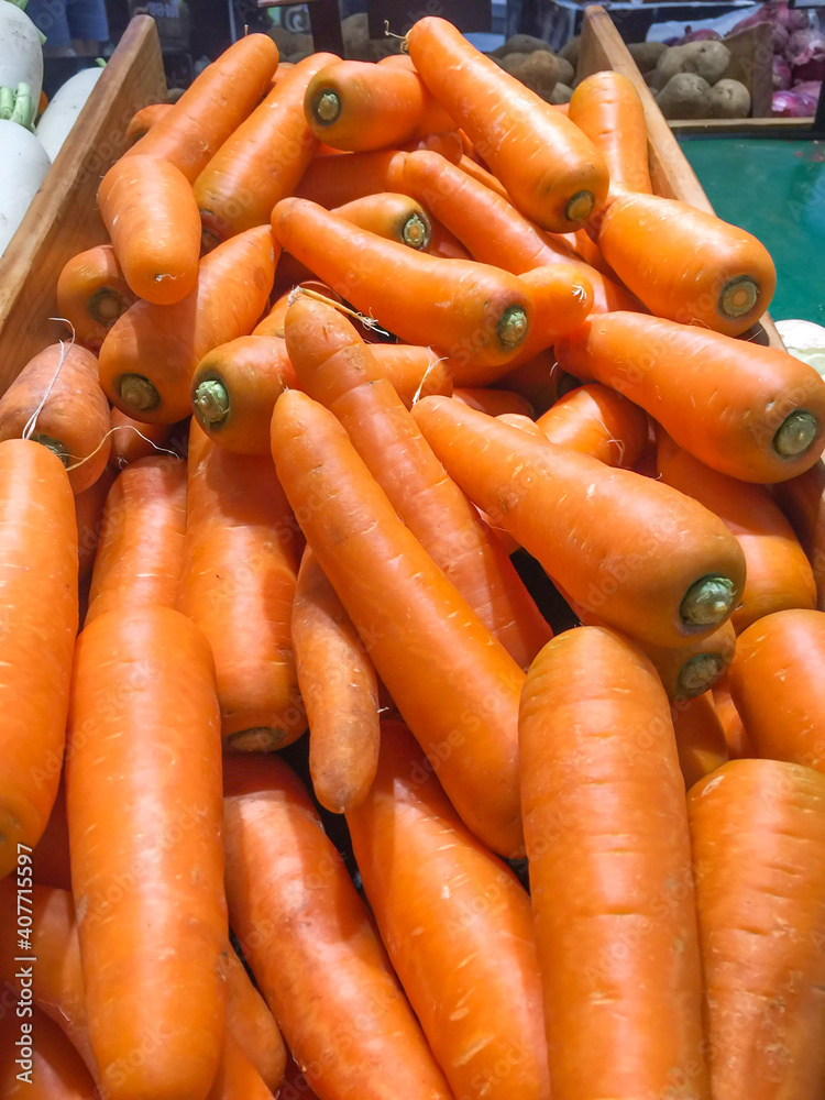 jumbo pile of large carrots background. jumbo pile of large carrots background.
