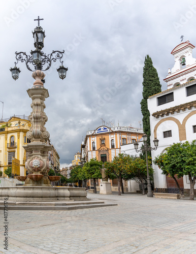 town square and historic fountain and buildings in the historic old city of Seville