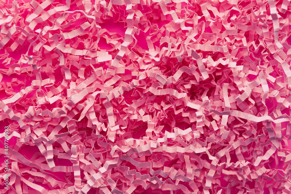 a background of pink cut paper