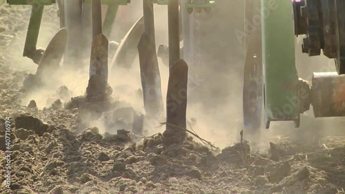 tillage in the field with a tractor with a machine