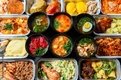 Business lunch in eco plastic container ready for delivery.Top view. Office Lunch boxes with food ready to go. Food takes away. Catering, brakfast