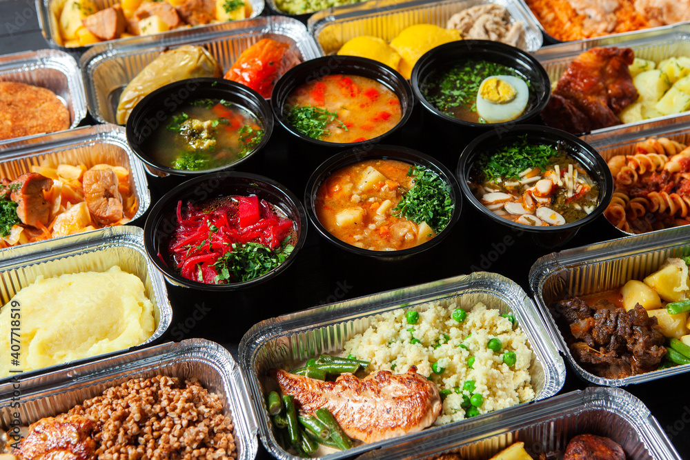 Business lunch in eco plastic container ready for delivery.Top view. Office Lunch boxes with food ready to go. Food takes away. Catering, brakfast Business lunch in eco plastic container ready for delivery.Top view. Office Lunch boxes with food ready to go. Food takes away. Catering, brakfast