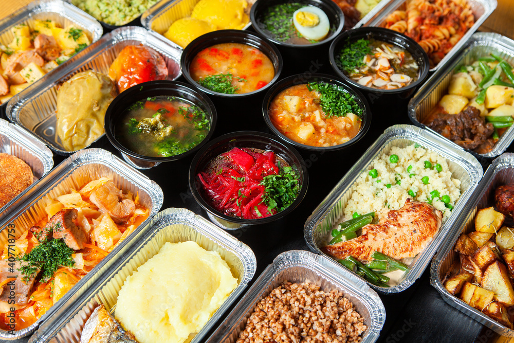 Business lunch in eco plastic container ready for delivery.Top view. Office Lunch boxes with food ready to go. Food takes away. Catering, brakfast