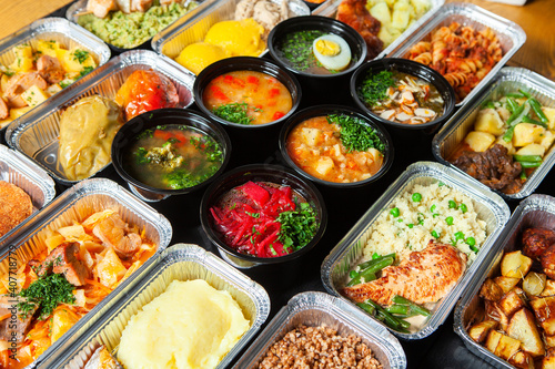Business lunch in eco plastic container ready for delivery.Top view. Office Lunch boxes with food ready to go. Food takes away. Catering, brakfast © romeof
