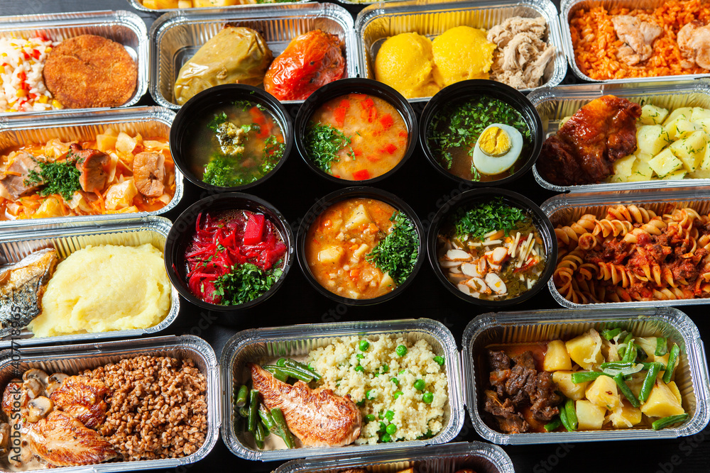 Business lunch in eco plastic container ready for delivery.Top view. Office Lunch boxes with food ready to go. Food takes away. Catering, brakfast