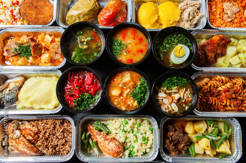 Business lunch in eco plastic container ready for delivery.Top view. Office Lunch boxes with food ready to go. Food takes away. Catering, brakfast