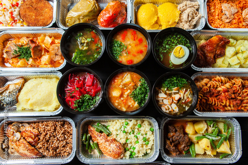Business lunch in eco plastic container ready for delivery.Top view. Office Lunch boxes with food ready to go. Food takes away. Catering, brakfast