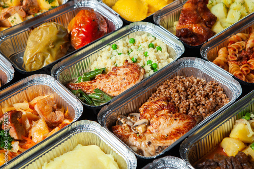 Business lunch in eco plastic container ready for delivery.Top view. Office Lunch boxes with food ready to go. Food takes away. Catering, brakfast.