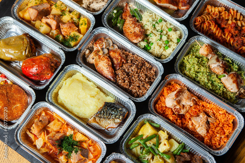 Business lunch in eco plastic container ready for delivery.Top view. Office Lunch boxes with food ready to go. Food takes away. Catering, brakfast.