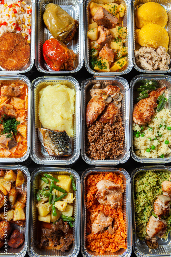 Business lunch in eco plastic container ready for delivery.Top view. Office Lunch boxes with food ready to go. Food takes away. Catering, brakfast.