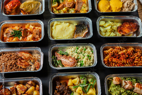 Business lunch in eco plastic container ready for delivery.Top view. Office Lunch boxes with food ready to go. Food takes away. Catering, brakfast. © romeof