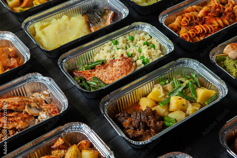 Business lunch in eco plastic container ready for delivery.Top view. Office Lunch boxes with food ready to go. Food takes away. Catering, brakfast.