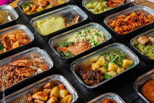 Business lunch in eco plastic container ready for delivery.Top view. Office Lunch boxes with food ready to go. Food takes away. Catering, brakfast.