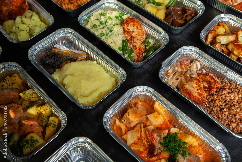 Business lunch in eco plastic container ready for delivery.Top view. Office Lunch boxes with food ready to go. Food takes away. Catering, brakfast. Business lunch in eco plastic container ready for delivery.Top view. Office Lunch boxes with food ready to go. Food takes away. Catering, brakfast.