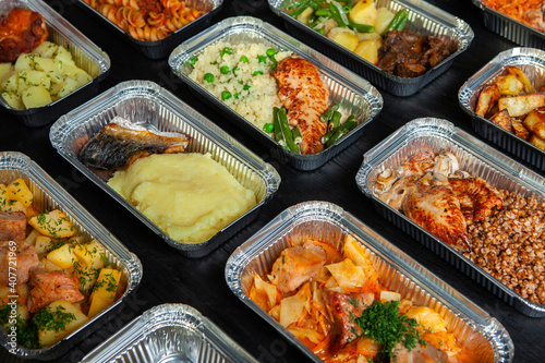 Business lunch in eco plastic container ready for delivery.Top view. Office Lunch boxes with food ready to go. Food takes away. Catering, brakfast.