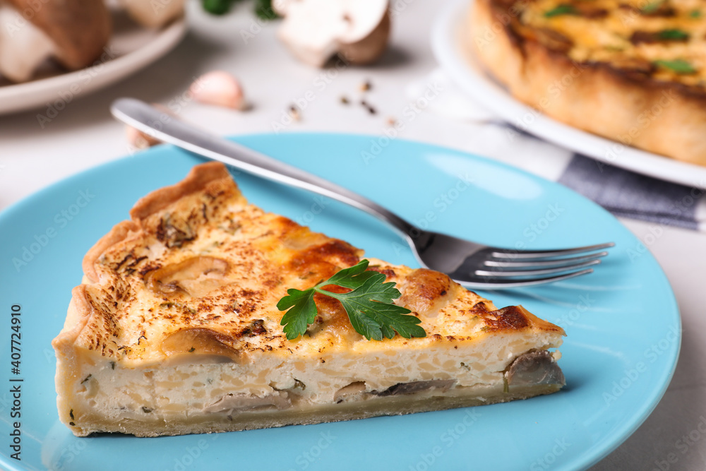 Delicious pie with mushrooms and cheese on light blue plate, closeup Delicious pie with mushrooms and cheese on light blue plate, closeup