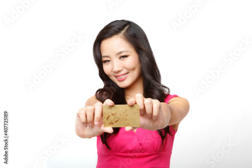 Fashion young woman holding a credit card