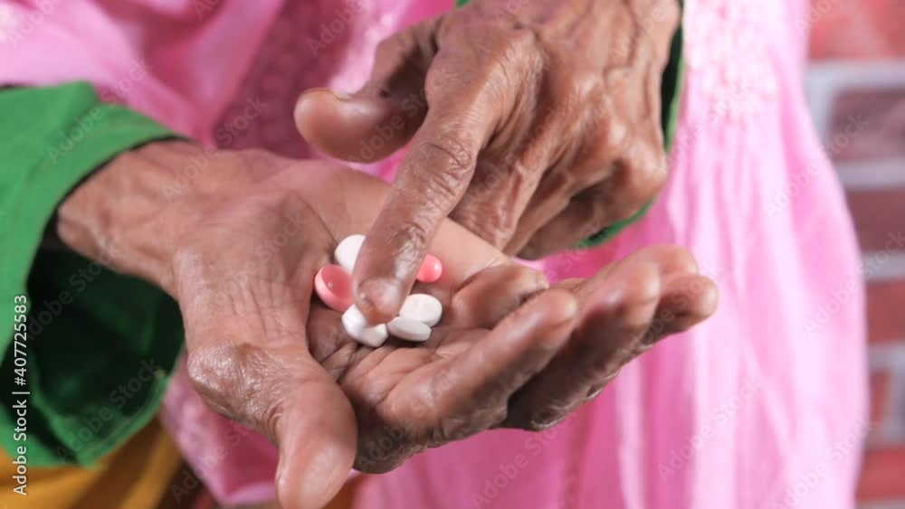 close up of pills and capsule on senior women's hand close up of pills and capsule on senior women's hand