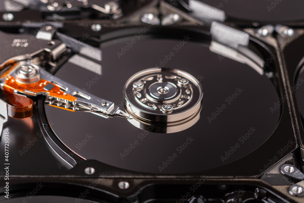 close up of an open hard disk drive close up of an open hard disk drive