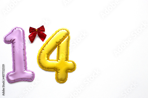 number 14 on a white background, pink and gold, red bow. Valentine's day, symbol. Place for your text.
