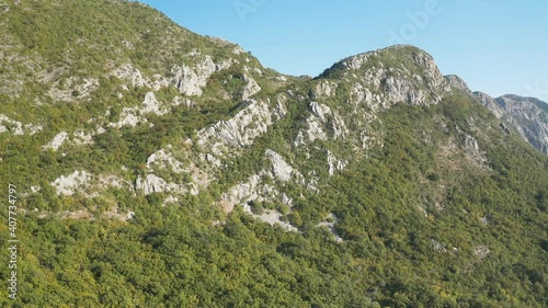 Green spring nature flourishing towards mountain top. View from the top of the mountain. Top view from drone. Mount Chelobrdo above Budva.
 photo