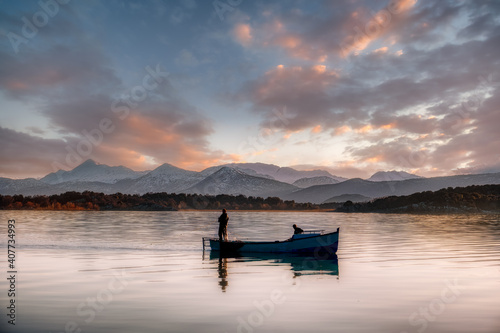 Fishing Boat on a lake © ResitUlas
