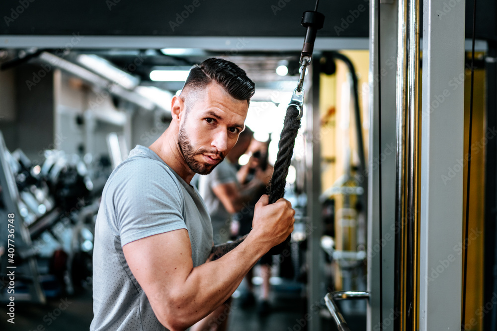 bodybuilding details and fitness workout. Man in sport gear working out at gym. Close up portrait. bodybuilding details and fitness workout. Man in sport gear working out at gym. Close up portrait.