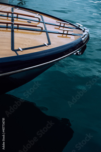 The front of a wooden yacht against the blue sea © Yevhenii