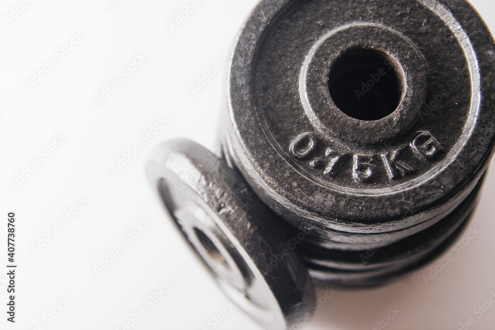 additional weights for dumbbells on a white background additional weights for dumbbells on a white background
