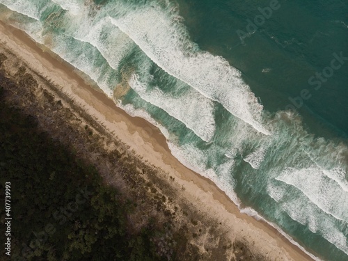 Aerial panorama of sand coast pacific ocean sea shore Opoutere beach waves Waikato Coromandel Peninsula New Zealand photo