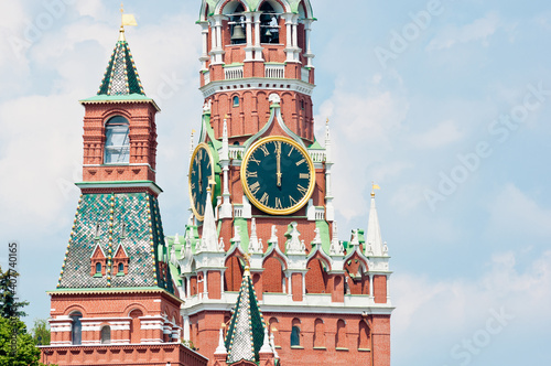 The Kremlin Clock (Kremlin Chimes). Spasskaya Tower of Moscow Kremlin. Twelve o'clock. Sunny summer day. Moscow. Russia