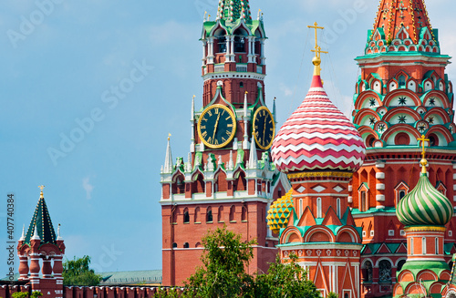 Spasskaya Tower of Moscow Kremlin and domes of the Cathedral of Vasily the Blessed (Saint Basil's Cathedral) on Red Square. Close-up. Moscow. Russia photo