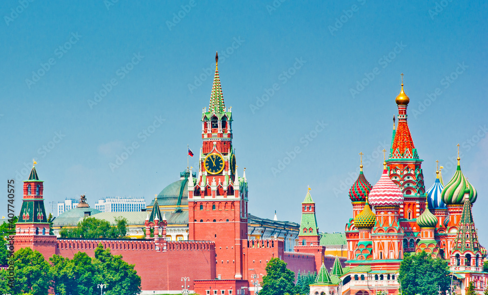 Spasskaya Tower of Moscow Kremlin and the Cathedral of Vasily the Blessed (Saint Basil's Cathedral) on Red Square. Sunny summer day. Moscow. Russia