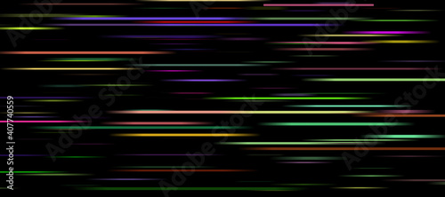 Glowing multicolored and blurred light stripes in motion on a dark background.