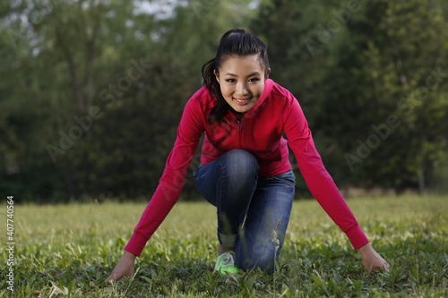 Oriental female youth running in the outdoors