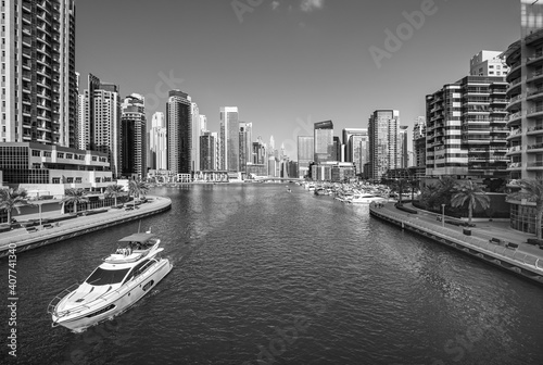 Obraz na płótnie Dubai skyline with reflection in the river at sunrise , Dubai, United Arab Emirates w salonie