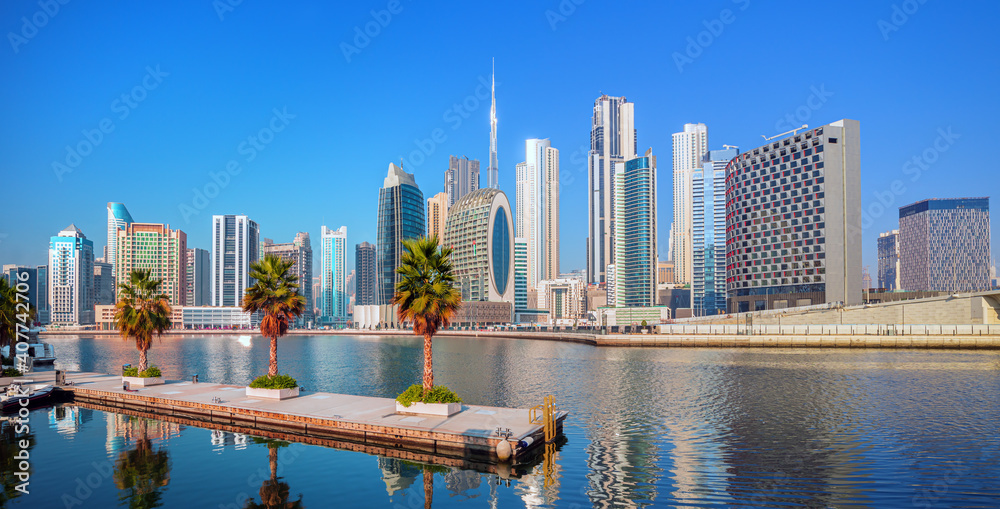 Dubai skyline with reflection in the river at sunrise , Dubai, United Arab Emirates