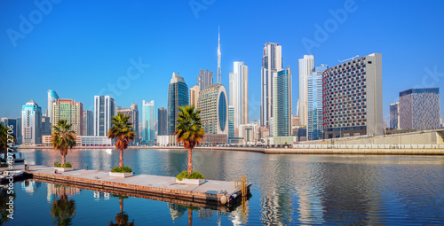 Obraz na płótnie Dubai skyline with reflection in the river at sunrise , Dubai, United Arab Emirates w salonie