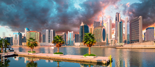 Obraz na płótnie Dubai skyline with reflection in the river at sunrise , Dubai, United Arab Emirates w salonie
