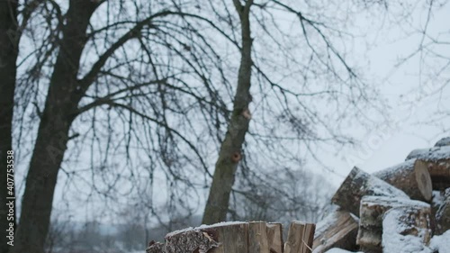 A man chops wood with an ax.