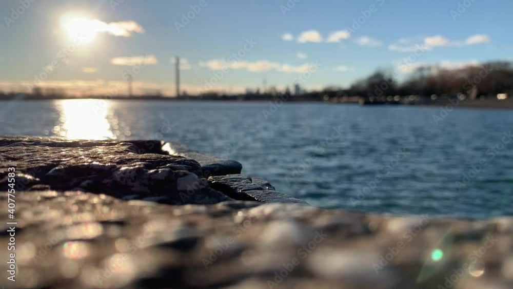 A stylized closeup of rocks and the Toronto skyline as seen from the Beaches neighbourhood along the shores of Lake Ontario. A stylized closeup of rocks and the Toronto skyline as seen from the Beaches neighbourhood along the shores of Lake Ontario.