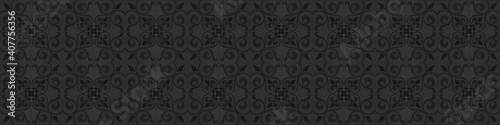 Old gray anthracite black vintage shabby damask floral flower leaves patchwork tiles stone concrete cement wall texture background banner panorama