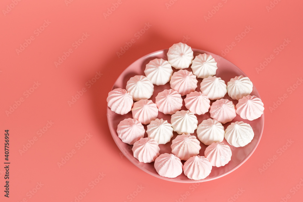 Sugar protein dessert in pastel colors in a pink plate on pink background. The view from the top. Copy Space Sugar protein dessert in pastel colors in a pink plate on pink background. The view from the top. Copy Space